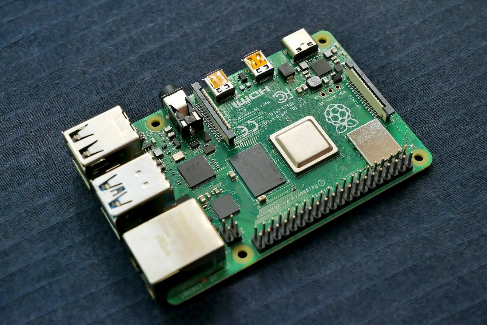 Raspberry Pi single-board computer with an ARM processor on dark fabric