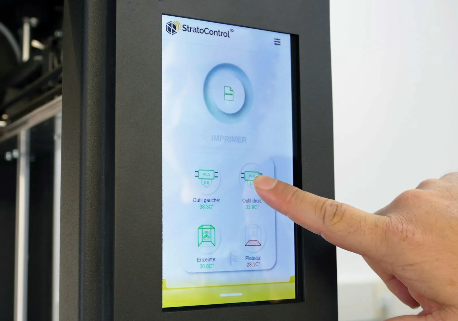 Finger selecting an option on an embedded touchscreen control interface